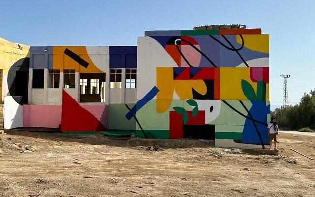 Artist Iker Muro painted a mural on abandoned Jordanian army barracks on the banks of the Dead Sea as part of Artists 4 Israel for Earth Day, April 22, 2023 (Courtesy Artists 4 Israel)