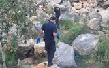 Police at the site where the body of a man in his 50s was located between the communities of Lapid and Hashmonaim, near the central city of Modiin, April 29, 2023. (Israel Police)
