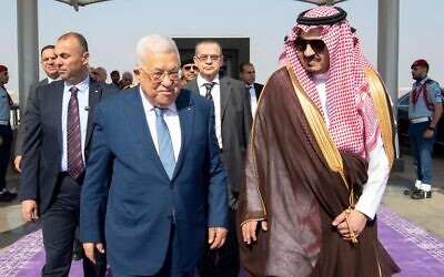 Palestinian Authority President Mahmoud Abbas (L) is met by Prince Badr bin Sultan bin Abdulaziz Al Saud (R) at the airport in Jeddah, April 17, 2023 (Wafa)
