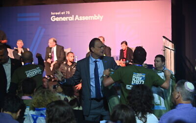 Protesters disrupt a discussion panel featuring MK Simcha Rothman at the Expo Tel Aviv convention center in Tel Aviv, Israel on April 24, 2023. (Canaan Lidor/Times of Israel)