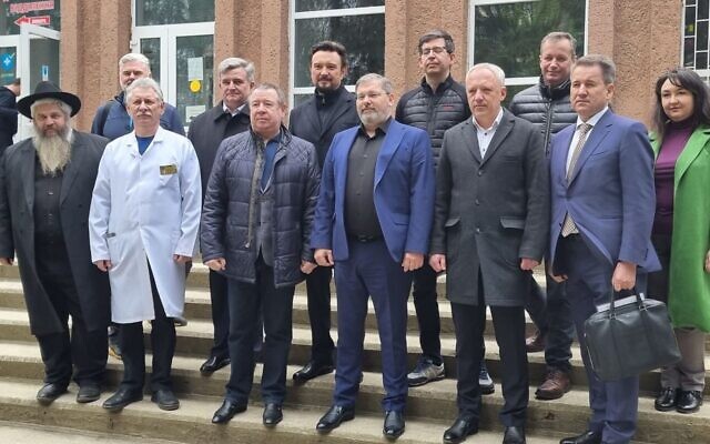 Rabbi Moshe Azman, left,with officials at the dedication of a new rehabilitation wing of a hospital in the city of Chernivtsi in western Ukraine, April 28, 2023. (Office of Rabbi Moshe Azman)