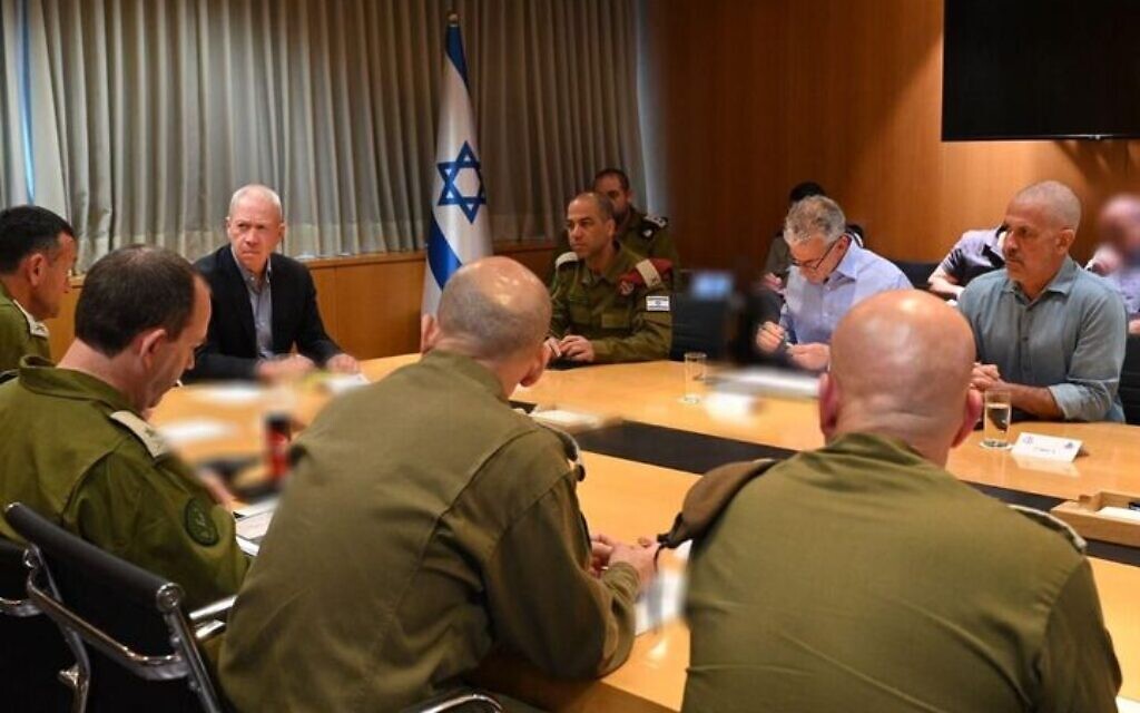 Defense Minister Yoav Gallant meets with senior military and defense officials at the IDF's headquarters in Tel Aviv, April 6, 2023. (Ariel Hermoni/Defense Ministry)