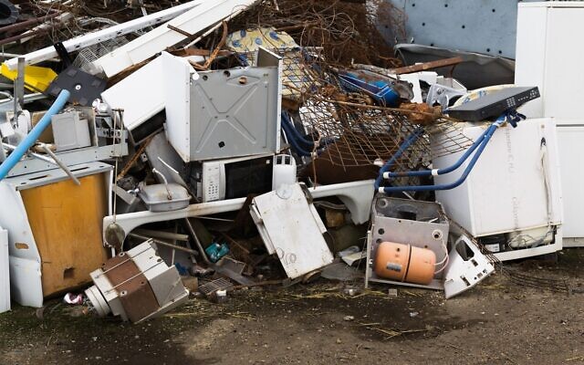 Pile of scrap white goods including fridges and freezers waiting to be recycled. (JohnDWilliams, iStock at Getty Images)