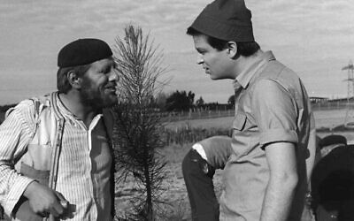 Chaim Topol (left) in Efraim Kishon's 1964 film, 'Sallah Shabati,' now available to screen for a nominal fee from the Jerusalem Cinematheque Archives, through May 2023 (Courtesy United King Films)