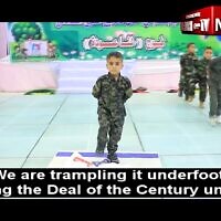 A Gazan preschooler stomps on an Israeli flag at a graduation ceremony, at the Young Deer Kindergarten in Beit Hanoun, in footage posted from May 24 - May 27, 2023. (MEMRI screenshot)