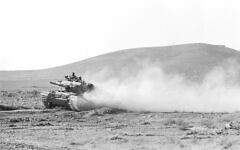 A IDF Sho't Kal (Centurion) tank is seen driving in the northern Golan Heights on October 11, 1973, during a counterattack by the 7th Brigade or 179th Brigade during the Yom Kippur War. (Avraham Vered/Defense Ministry Archives)