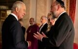 Britain's King Charles III (left) meets Chief Rabbi Ephraim Mirvis during a reception with faith leaders at Buckingham Palace in London on September 16, 2022. (Aaron Chown / AFP)