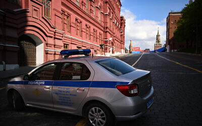 A police car is seen parked on the edge of Red Square in central Moscow on May 3, 2023. (NATALIA KOLESNIKOVA/AFP)