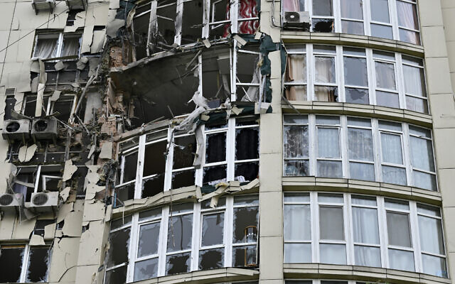 This photograph taken on May 8, 2023, shows a high-rise residential building damaged by remains of a shot down Russian drone in Kyiv, amid the Russian invasion of Ukraine (Genya SAVILOV / AFP)