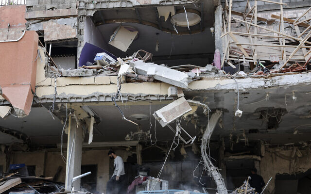 A damaged building is pictured after an Israeli airstrike in Gaza City on May 9, 2023. (Photo by MOHAMMED ABED / AFP)