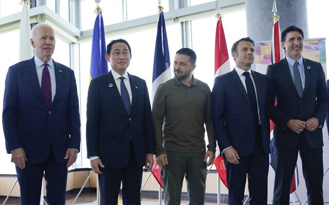 US President Joe Biden, Japan's Prime Minister Fumio Kishida, Ukraine's President Volodymyr Zelensky, France's President Emmanuel Macron, Canada's Prime Minister Justin Trudeau pose for a family photo ahead of a working session on Ukraine during the G7 Leaders' Summit in Hiroshima on May 21, 2023. (Susan Walsh / POOL / AFP)