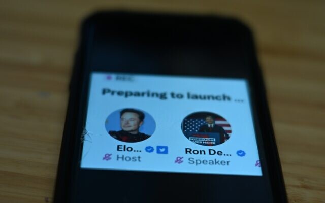 This photo shows the live Twitter talk between Elon Musk and Ron DeSantis diplayed on a phone on May 24, 2023 in Bethesda, Maryland. (Pedro UGARTE / AFP)