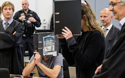 The defendant Lina E. (C-R) and a other defendant (C-L) are seen in the courtroom at the higher regional court in Dresden, eastern Germany, on May 31, 2023. (JENS SCHLUETER / AFP)