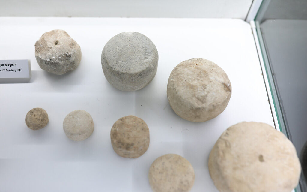Stone weights discovered on the Pilgrimage Path. The inscription joins these findings attesting to the commercial nature of the area. (Tomer Avital)
