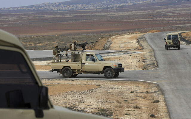 Jordanian soldiers patrol along the eastern Jordan-Syria border, in al-Washash, Mafraq governorate, Jordan, February 17, 2022. (Raad Adayleh/AP)