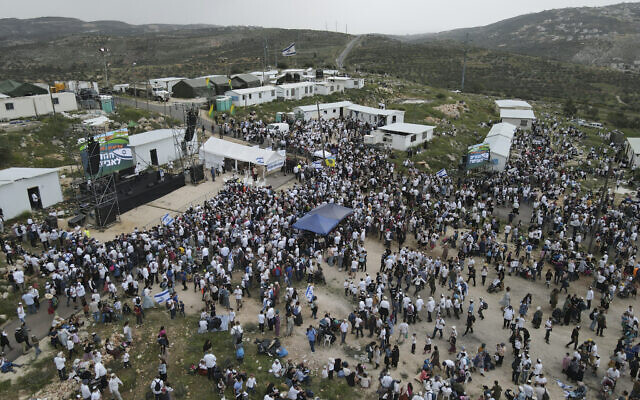 Israelis gather at the Evyatar outpost in the West Bank on April 10, 2023. (AP/Ariel Schalit)