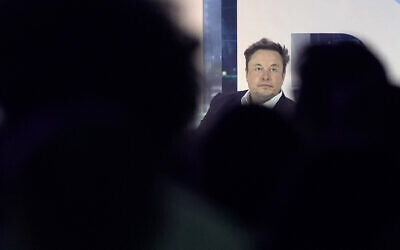Twitter CEO Elon Musk is seen on stage as he speaks at the POSSIBLE marketing conference, April 18, 2023, in Miami Beach, Florida. (AP Photo/Rebecca Blackwell)