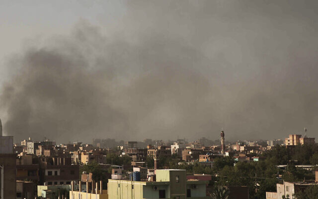 Smoke rises in Khartoum, Sudan, April 29, 2023, as gunfire and heavy artillery fire continued despite the extension of a cease-fire between the country's two top generals. (AP Photo/Marwan Ali)