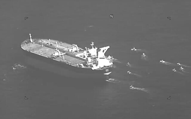 This still image from video released by the U.S. Navy shows the Panama-flagged oil tanker Niovi surrounded by Iranian Revolutionary Guard vessels in the Strait of Hormuz Wednesday, May 3, 2023. Iran seized a Panama-flagged oil tanker in the Strait of Hormuz on Wednesday, the second-such capture by Tehran in recent days, the U.S. Navy said. (U.S. Navy via AP)