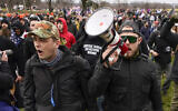 File: Proud Boys members Zachary Rehl, left, and Ethan Nordean, right, walk toward the US Capitol in Washington, in support of President Donald Trump on Jan. 6, 2021. Former Proud Boys leader Enrique Tarrio and three other members of the far-right extremist group were convicted Thursday, May 4, 2023, of a plot to attack the US Capitol in a desperate bid to keep Donald Trump in power after the Republican lost the 2020 presidential election. (AP/Carolyn Kaster)