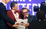 Cleveland Cavaliers owner Dan Gilbert and his son, Nick Gilbert, at an NBA basketball draft lottery in New York, May 21, 2013. (AP Photo/Jason DeCrow, File)