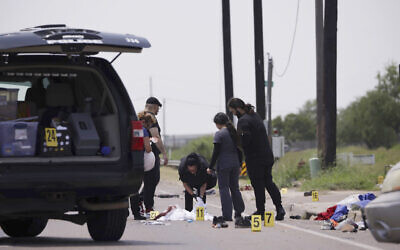 Emergency personnel respond to a fatal collision in Brownsville, Texas, on Sunday, May 7, 2023. Several migrants were killed after they were struck by a vehicle while waiting at a bus stop near Ozanam Center, a migrant and homeless shelter. (AP Photo/Michael Gonzalez)