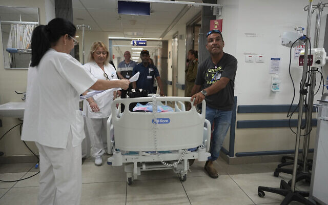 A pediatric patient is moved to a protected area at Barzilai Hospital in Ashkelon, southern Israel, under threat of rockets fired from the Gaza Strip after Israel killed three senior commanders of the Islamic Jihad group in targeted airstrikes, Tuesday, May 9, 2023.  (AP Photo/Tsafrir Abayov)