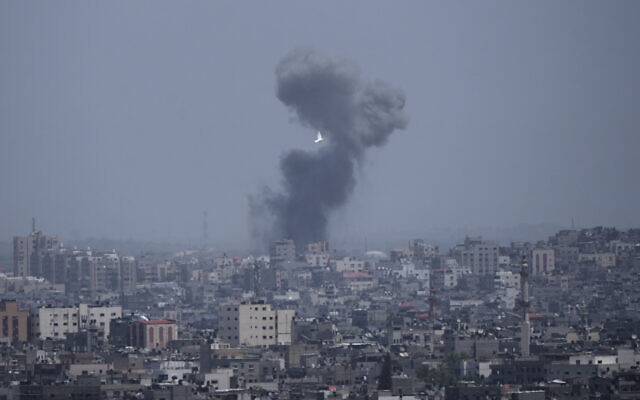 Smoke rises from an explosion caused by an Israeli airstrike in the Gaza Strip after rocket fire, May 13, 2023. (AP Photo/Hatem Moussa)