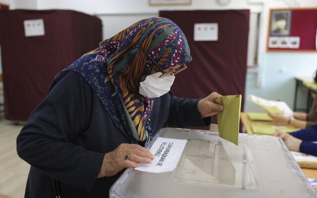 A woman votes at a polling station in Ankara, Turkey, Sunday, May 14, 2023. Voters in Turkey go to the polls on Sunday for pivotal parliamentary and presidential elections that are expected to be tightly contested and could be the biggest challenge Turkish President Recep Tayyip Erdogan faces in his two decades in power. (AP Photo)