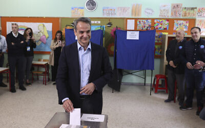 Greece's Prime Minister and leader of New Democracy Kyriakos Mitsotakis votes at a polling station in Athens, Greece, May 21, 2023. (Yorgos Karahalis/AP)