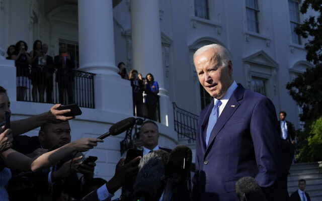 US President Joe Biden talks with reporters before boarding Marine One on the South Lawn of the White House in Washington, May 26, 2023. (Susan Walsh/AP)