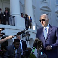 US President Joe Biden talks with reporters on the South Lawn of the White House in Washington, May 26, 2023, as he heads to Camp David for the weekend. (AP Photo/Susan Walsh)