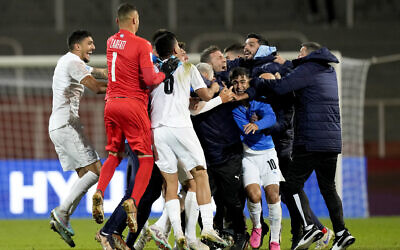 Israel's team celebrates winning 2-1 against Japan at the end of a FIFA U-20 World Cup Group C soccer match at the Malvinas Argentinas stadium in Mendoza, Argentina, May 27, 2023. (AP Photo/Natacha Pisarenko)