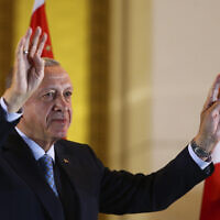 Turkish President and People's Alliance's presidential candidate Recep Tayyip Erdogan gestures to supporters at the presidential palace, in Ankara, Turkey, Sunday, May 28, 2023. (AP/Ali Unal)