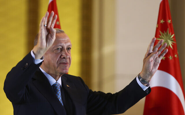 Turkish President and People's Alliance's presidential candidate Recep Tayyip Erdogan gestures to supporters at the presidential palace, in Ankara, Turkey, Sunday, May 28, 2023. (AP/Ali Unal)