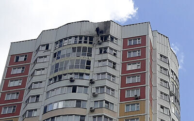 An investigator inspects a damage after an alleged Ukrainian drone attacked an apartment building in Moscow, Russia, May 30, 2023. (AP)