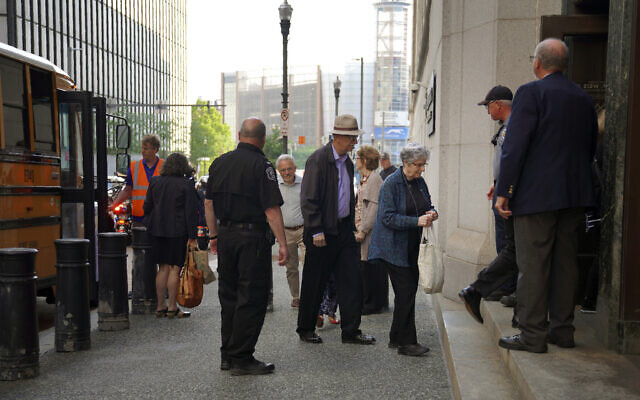 Members of Pittsburgh's Jewish community enter the Federal courthouse in Pittsburgh for the first day of trial for Robert Bowers, the suspect in the 2018 synagogue massacre on Tuesday, May 30, 2023, in Pittsburgh.  (AP Photo/Jessie Wardarski)
