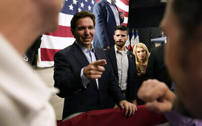 Republican presidential hopeful Florida Gov. Ron DeSantis greets audience members during a campaign event, May 30, 2023, in Clive, Iowa. (AP Photo/Charlie Neibergall)