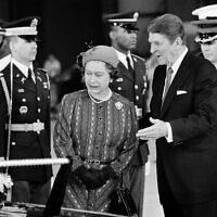 President Ronald Reagan escorts Queen Elizabeth II to a waiting limousine, March 1, 1983, following their meeting in Santa Barbara, Calif.  (AP Photo)