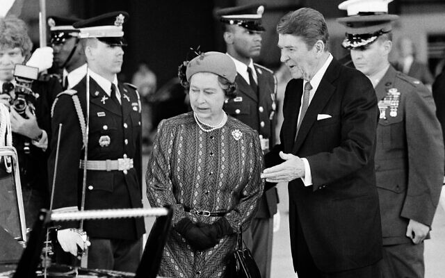 President Ronald Reagan escorts Queen Elizabeth II to a waiting limousine, March 1, 1983, following their meeting in Santa Barbara, Calif.  (AP Photo)