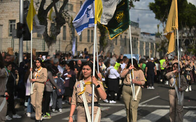 Arab-Christian Scouts march at the Virgin Mary Procession in Haifa, Israel on April 30, 2023. (Canaan Lidor/Times of Israel)