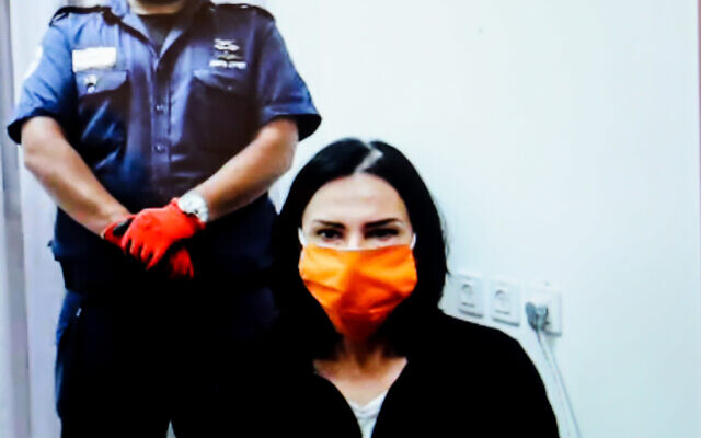 File: Former champion athlete Svetlana Gnezdilov, seen on a screen via a video link during a court hearing for sex trafficking charges at the Tel Aviv District Court on June 22, 2020. (Avshalom Sassoni/Flash90)
