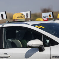 Taxis park during a protest against a change in meter prices in Tel Aviv, March 2, 2021. (Miriam Alster/Flash90)