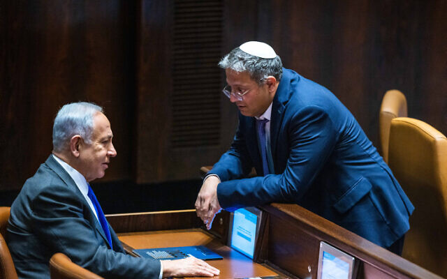 Illustrative: Likud leader MK Benjamin Netanyahu with head of the far-right Otzma Yehudit party MK Itamar Ben Gvir at a vote in the Knesset plenum, December 28, 2022. (Olivier Fitoussi/Flash90)