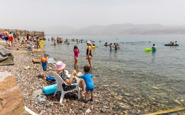Illustrative: Israelis crowd a beach near Eilat, southern Israel, on April 7, 2023. (Yossi Aloni/Flash90