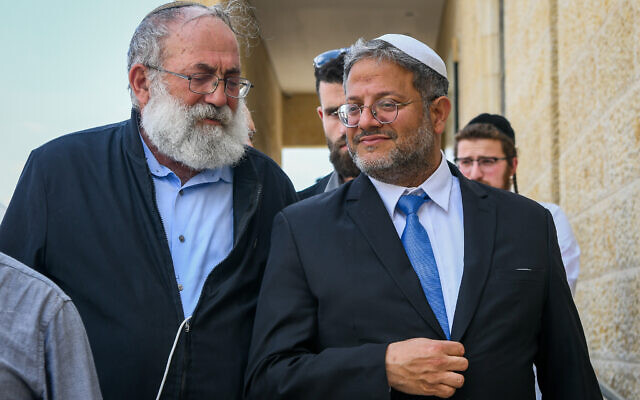 National Security Minister Itamar Ben Gvir (right) walks with Matityahu Dan, chairman of the Ateret Cohanim organization, after a meeting at Jerusalem's Western Wall, May 7, 2023. (Arie Leib Abrams/Flash90)