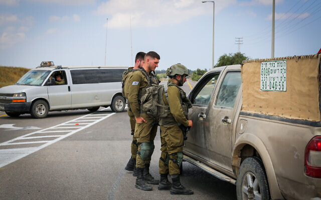 Soldiers block a road near the border with Gaza, southern Israel, on May 9, 2023 (Flash90)