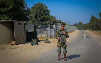 An Israel soldier blocks a road near the border with Gaza, southern Israel, on May 10, 2023. (Flash90)