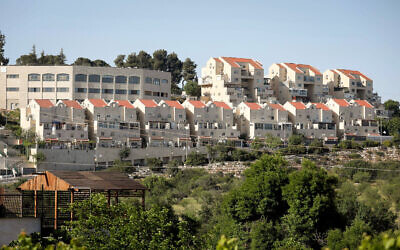 A general view shows houses in the West Bank settlement of Kiryat Arba, May 10, 2023. (Wisam Hashlamounn/ Flash90)