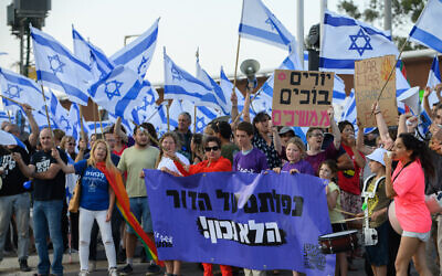 Protesters against the government's planned judicial overhaul at Goma Junction, northern Israel, on May 13, 2023. (Ayal Margolin/Flash90)